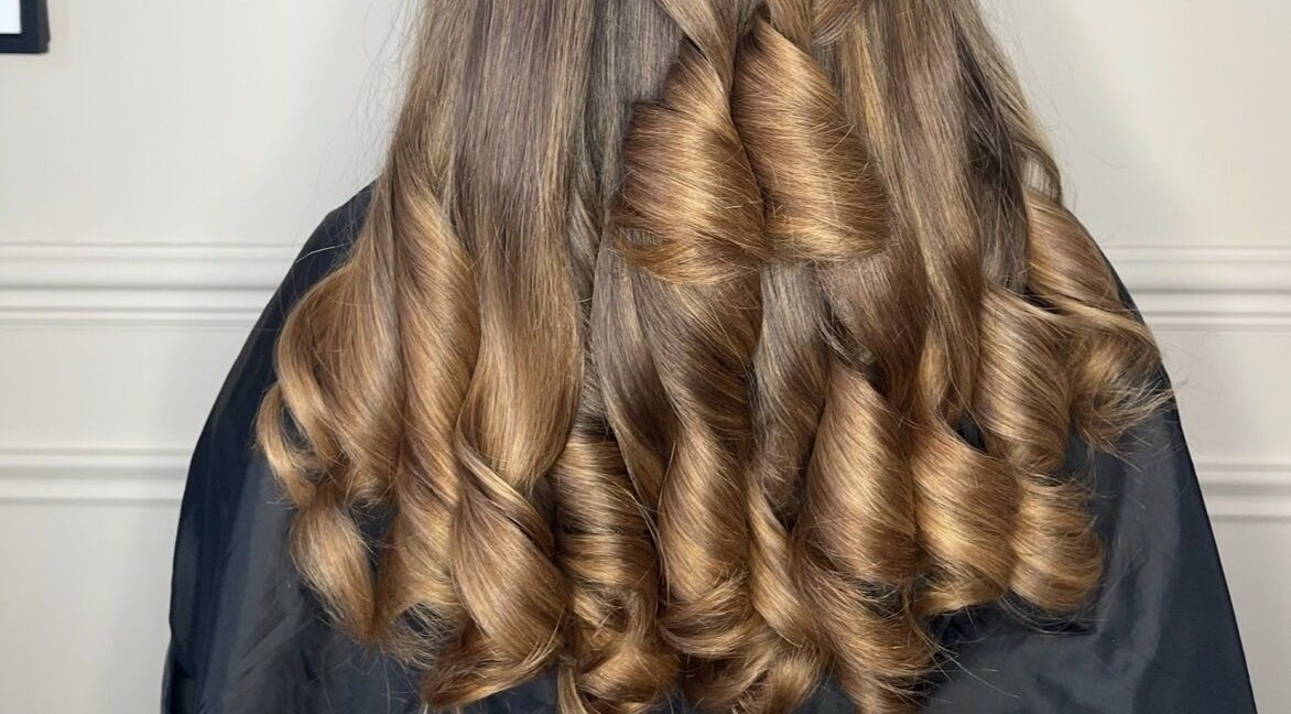 Elegant curled hairstyle at The Blowdry Bar and Training Academy, Torquay, England, GB.