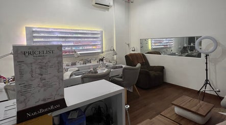 Interior of Nails Bhen Rani Beauty Studio in Bali, Bali, ID, featuring manicure stations and product displays.