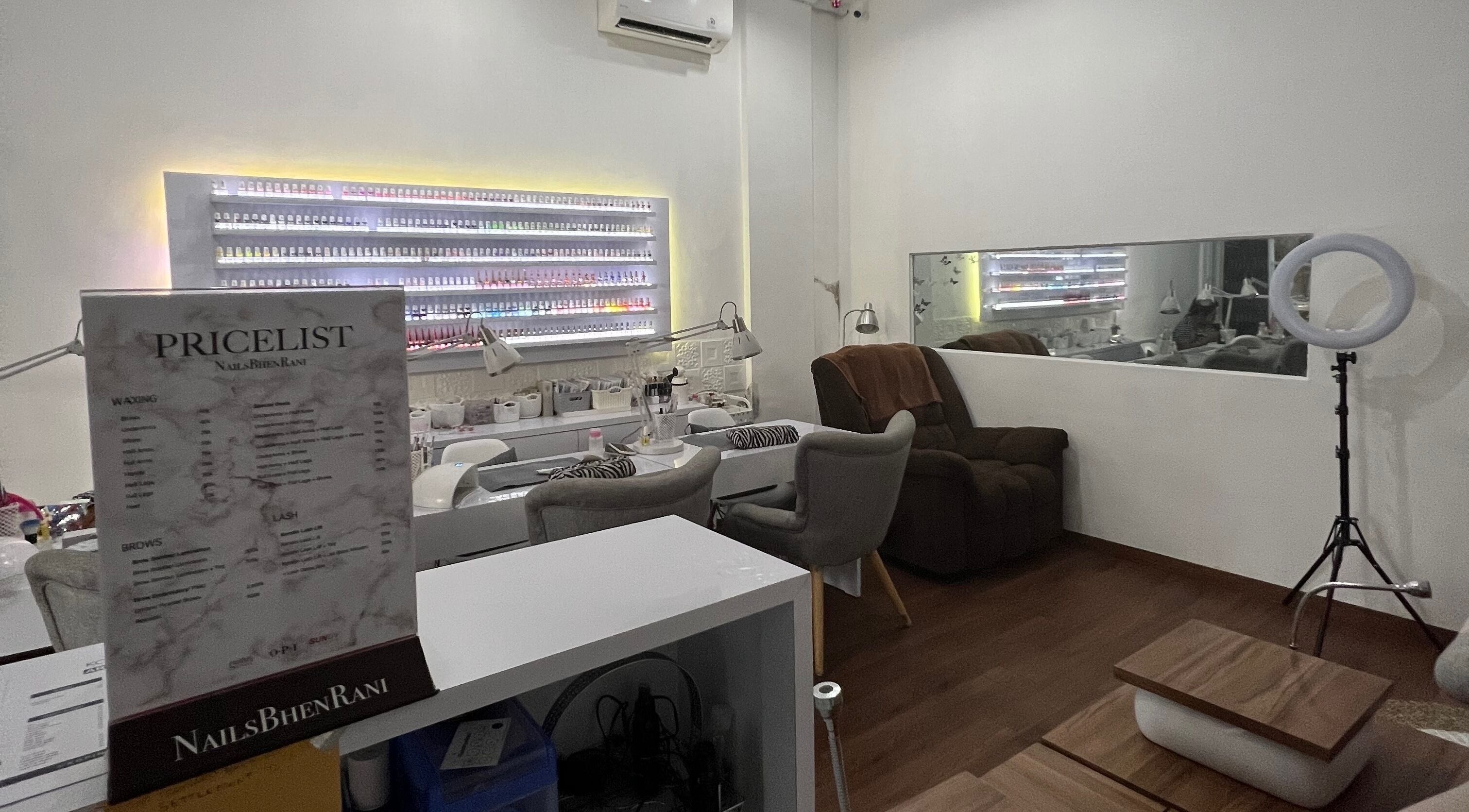 Interior of Nails Bhen Rani Beauty Studio in Bali, Bali, ID, featuring manicure stations and product displays.