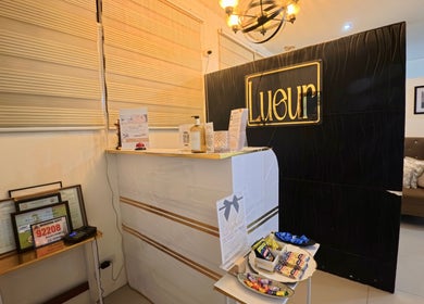 Front desk of Lueur Beauty and Wellness in Quezon City, Metro Manila, PH, showcasing a stylish and welcoming ambiance.