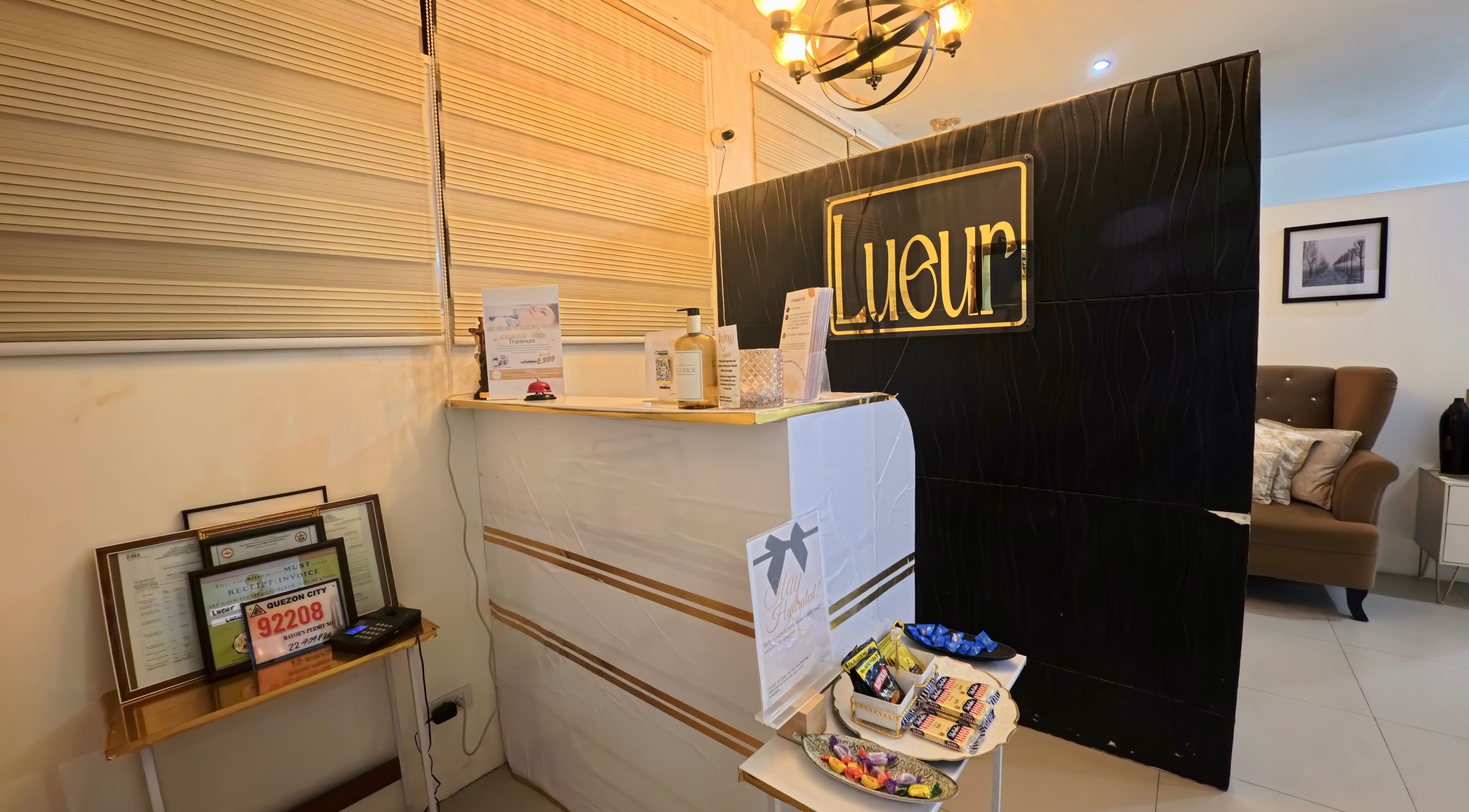 Front desk of Lueur Beauty and Wellness in Quezon City, Metro Manila, PH, showcasing a stylish and welcoming ambiance.
