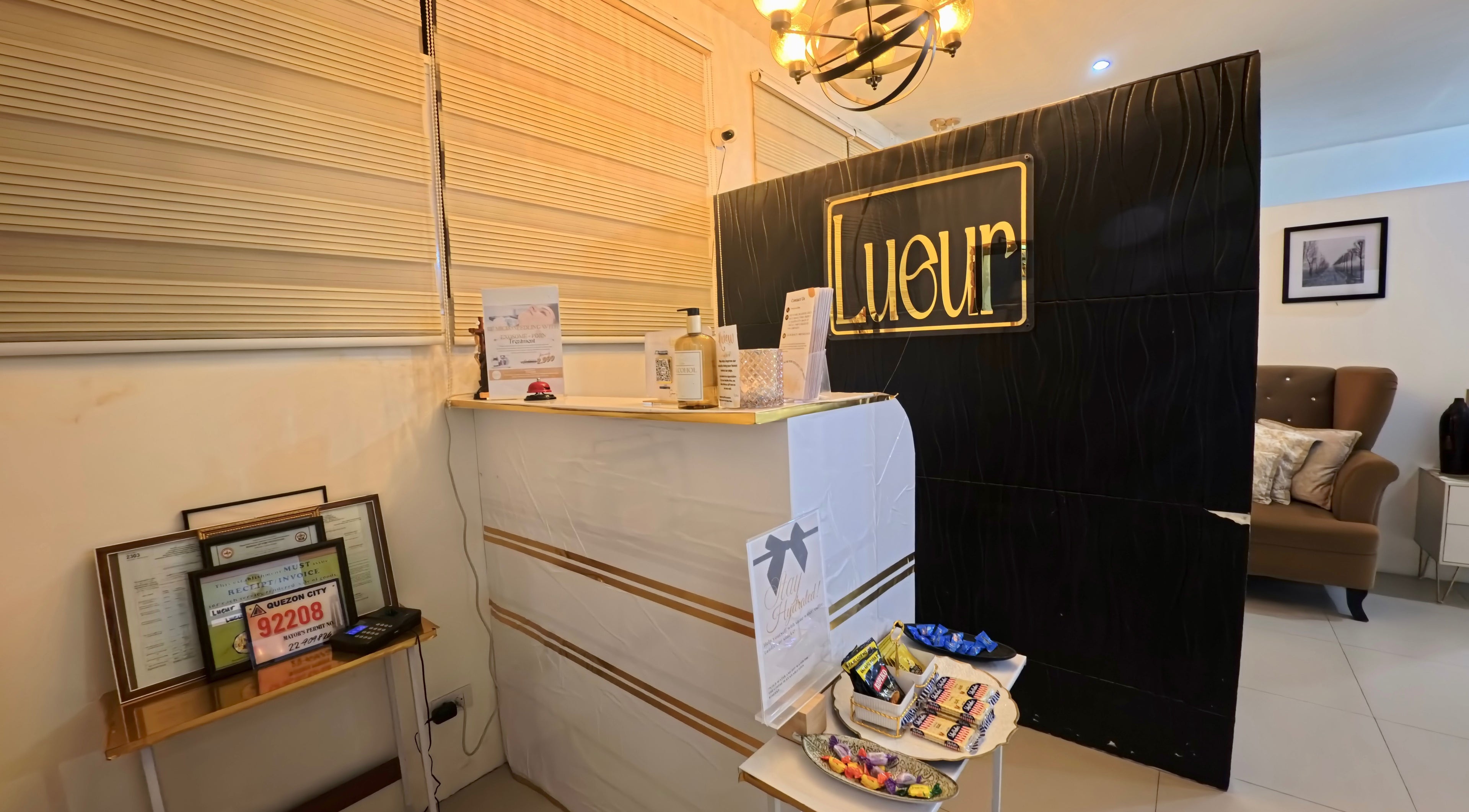 Front desk of Lueur Beauty and Wellness in Quezon City, Metro Manila, PH, showcasing a stylish and welcoming ambiance.
