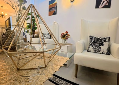 Chic waiting area at Lueur Beauty and Wellness, Quezon City, Metro Manila, PH with modern decor and comfy seating.