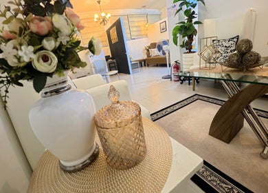 Elegant interior of Lueur Beauty and Wellness, Quezon City, Metro Manila, PH, featuring chic decor and plush seating.
