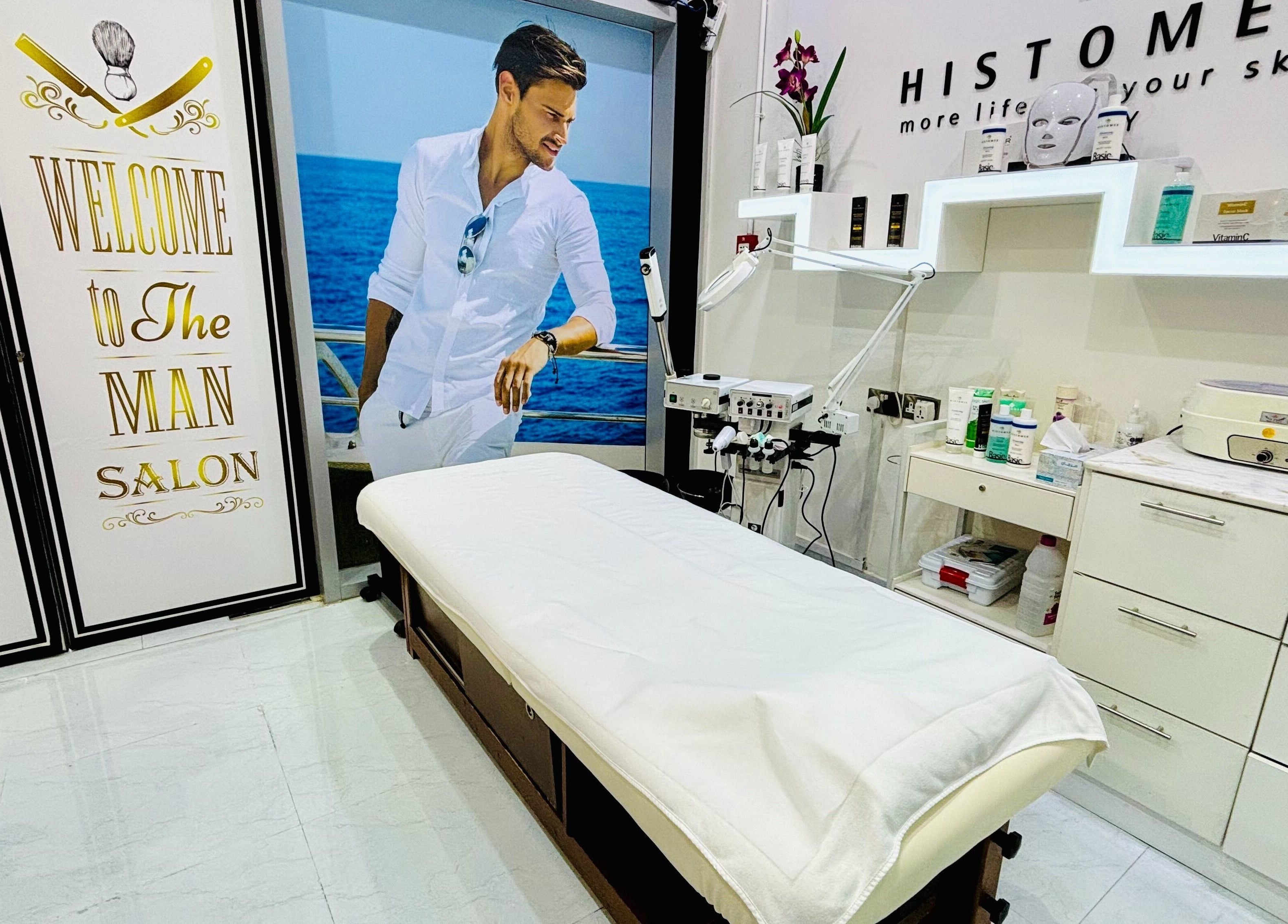 Treatment room at Comb and Scissors Gents Salon in Dubai, AE, featuring modern decor and comfortable setup.