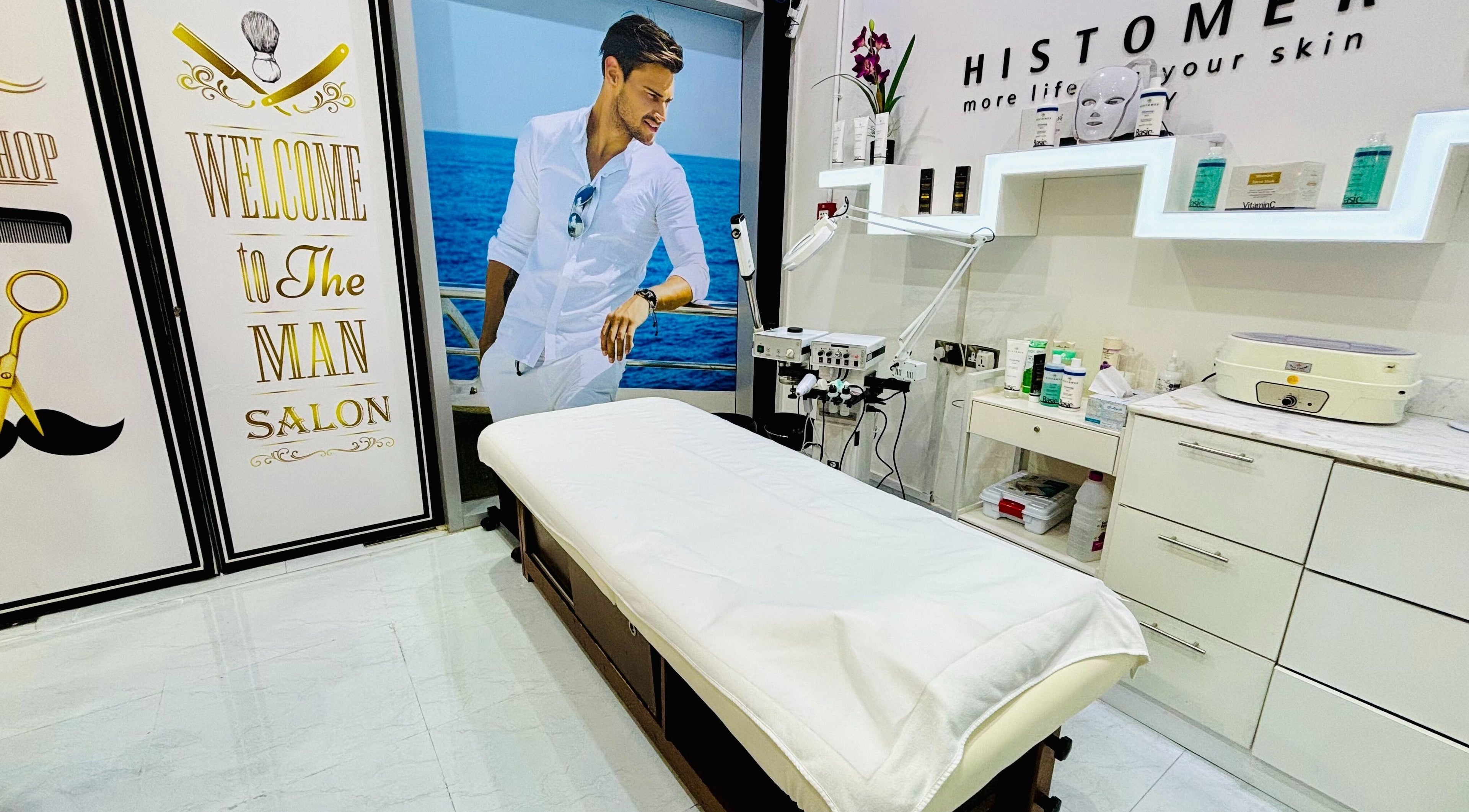 Treatment room at Comb and Scissors Gents Salon in Dubai, AE, featuring modern decor and comfortable setup.