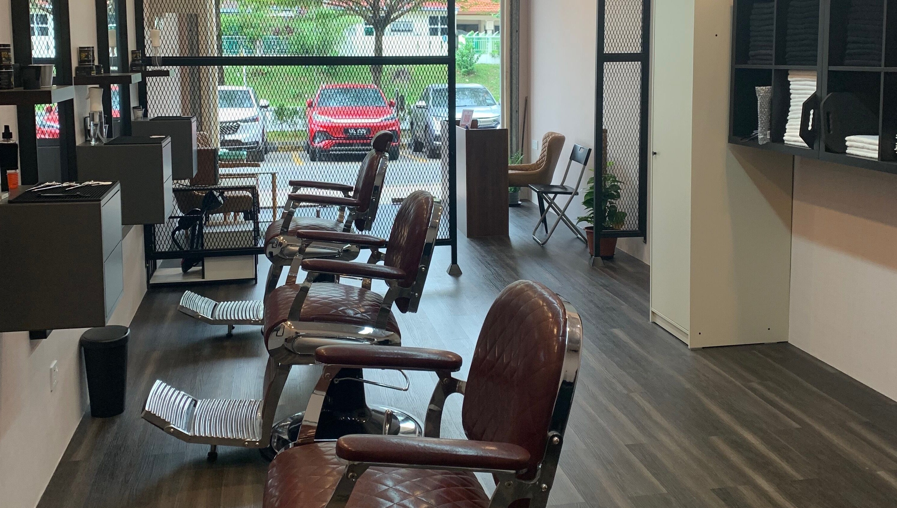 Modern interior of The Barbersmith Damansara in Petaling Jaya, Selangor, MY showcasing stylish barber chairs.
