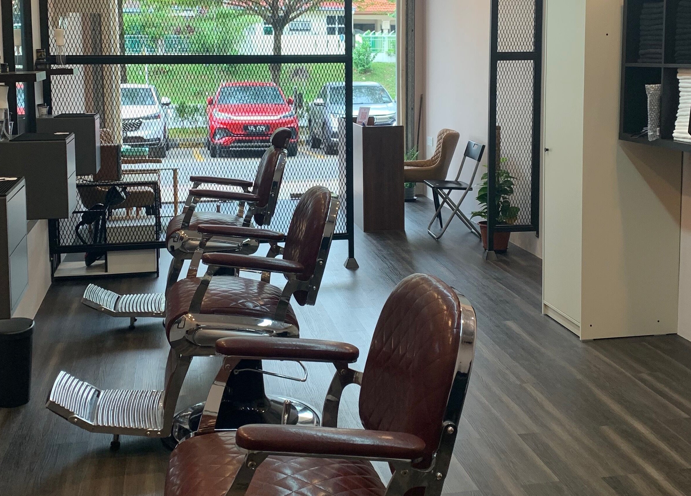 Modern interior of The Barbersmith Damansara in Petaling Jaya, Selangor, MY showcasing stylish barber chairs.