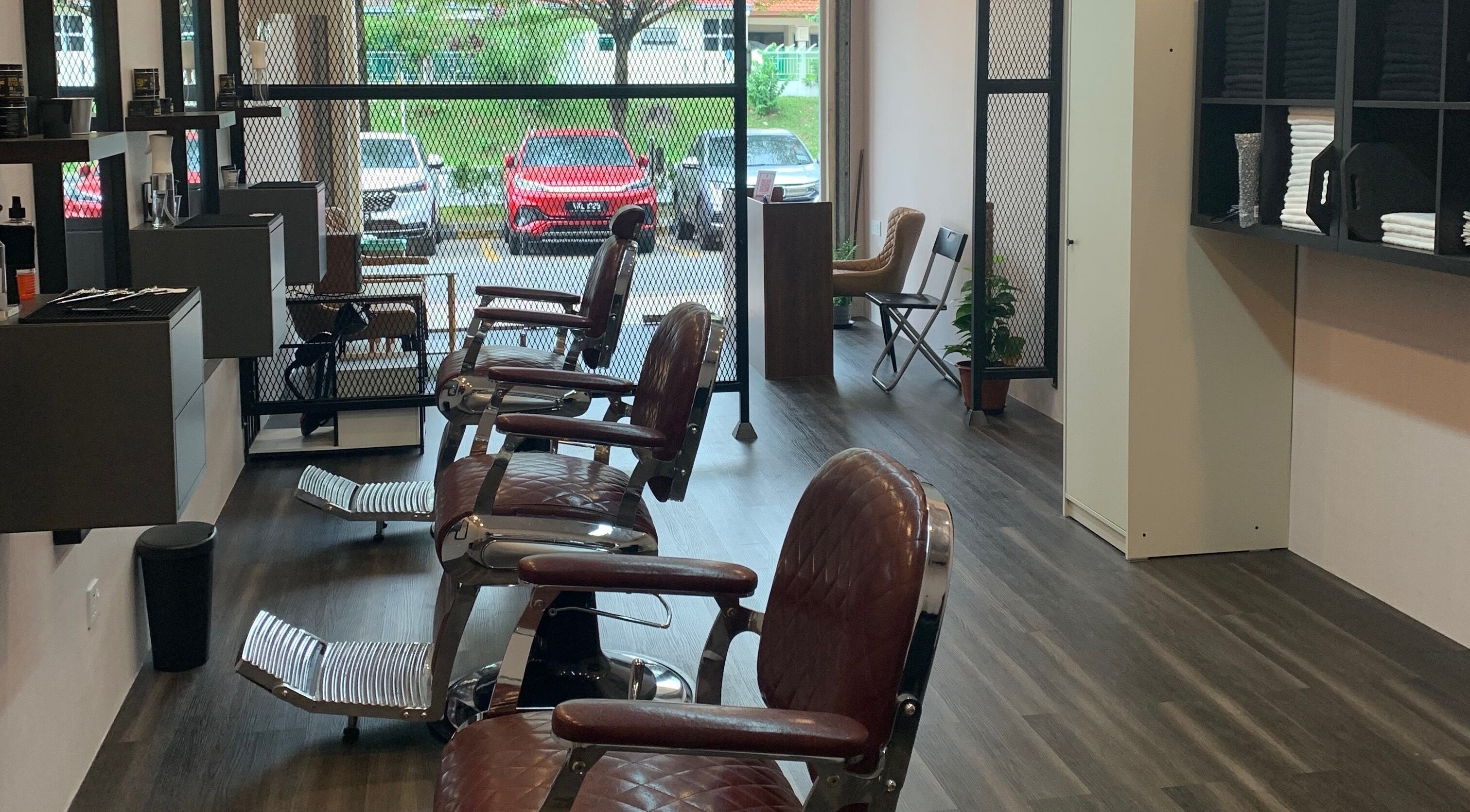 Modern interior of The Barbersmith Damansara in Petaling Jaya, Selangor, MY showcasing stylish barber chairs.