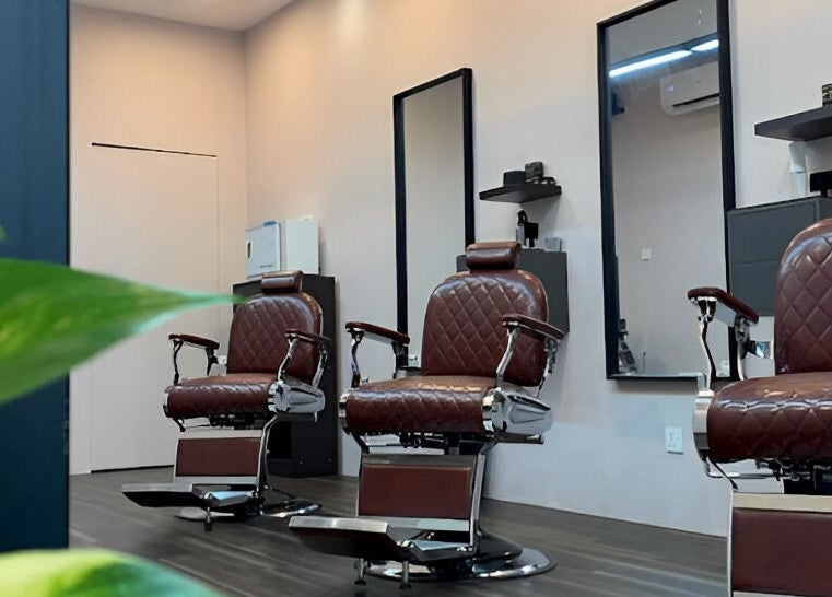 Elegant barber chairs at The Barbersmith Damansara, Petaling Jaya, Selangor, MY, showcasing style and comfort.