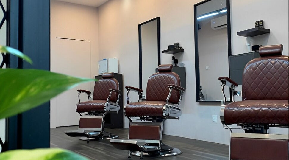 Elegant barber chairs at The Barbersmith Damansara, Petaling Jaya, Selangor, MY, showcasing style and comfort.