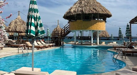 Relax at Feel Massage and Wellness ‘Mondi Beach Club’ in Willemstad, Curaçao, CW by the beautiful poolside.