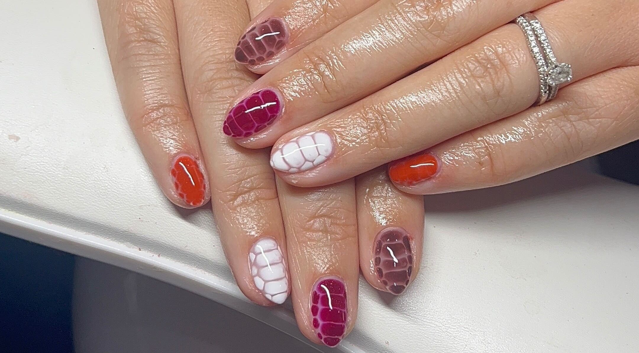 Beautiful multicolor foil nail art at Kommon Beauty, Farington, England, GB; showcasing creative designs.