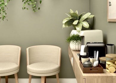 Relaxing waiting area at Live Simply Organic Wellness Spa in Kingston, St. Andrew Parish, JM, featuring cozy chairs.