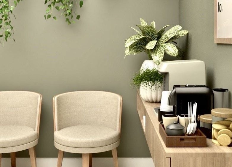 Relaxing waiting area at Live Simply Organic Wellness Spa, Kingston, St. Andrew Parish, JM with cozy chairs and plants.