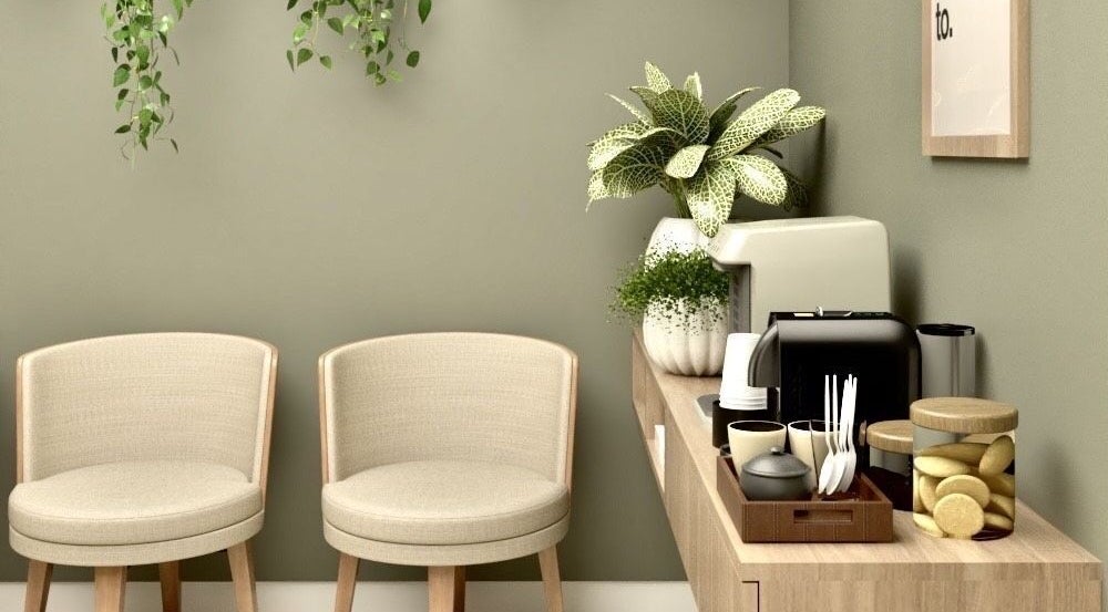 Relaxing waiting area at Live Simply Organic Wellness Spa, Kingston, St. Andrew Parish, JM with cozy chairs and plants.