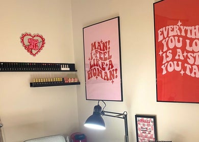 Stylish nail care setup at Nails by Shan in Cleckheaton, England, GB with vibrant wall art.