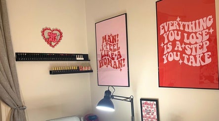 Stylish nail care setup at Nails by Shan in Cleckheaton, England, GB with vibrant wall art.