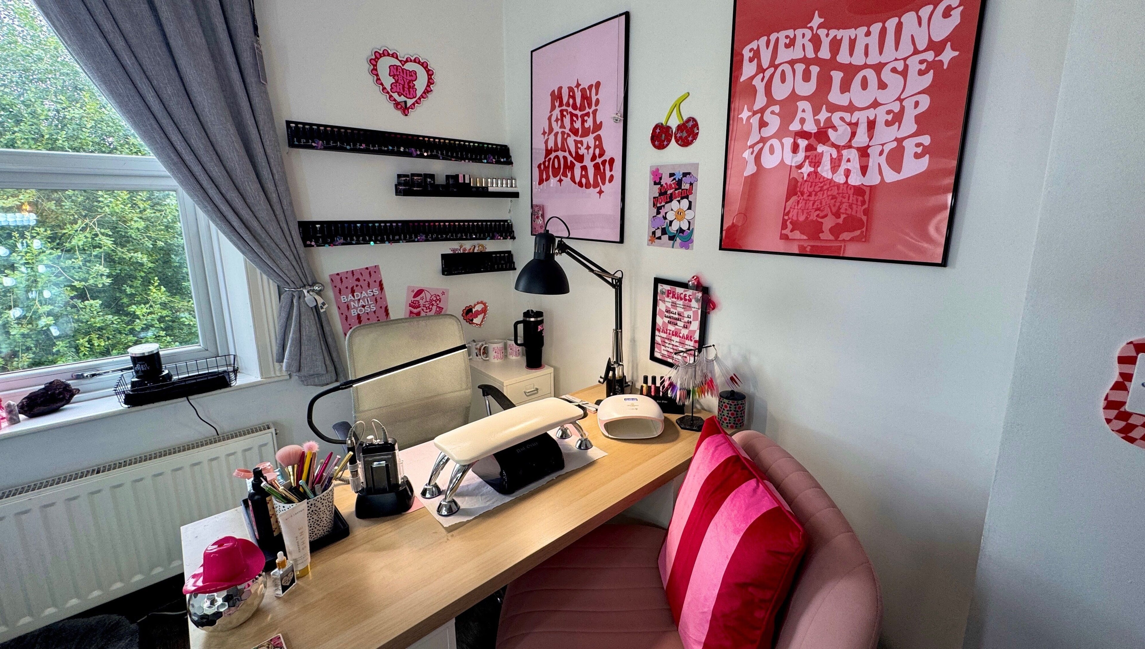 Nail station at Nails by Shan, Cleckheaton, England, GB. Stylish decor with pink accents and nail equipment.