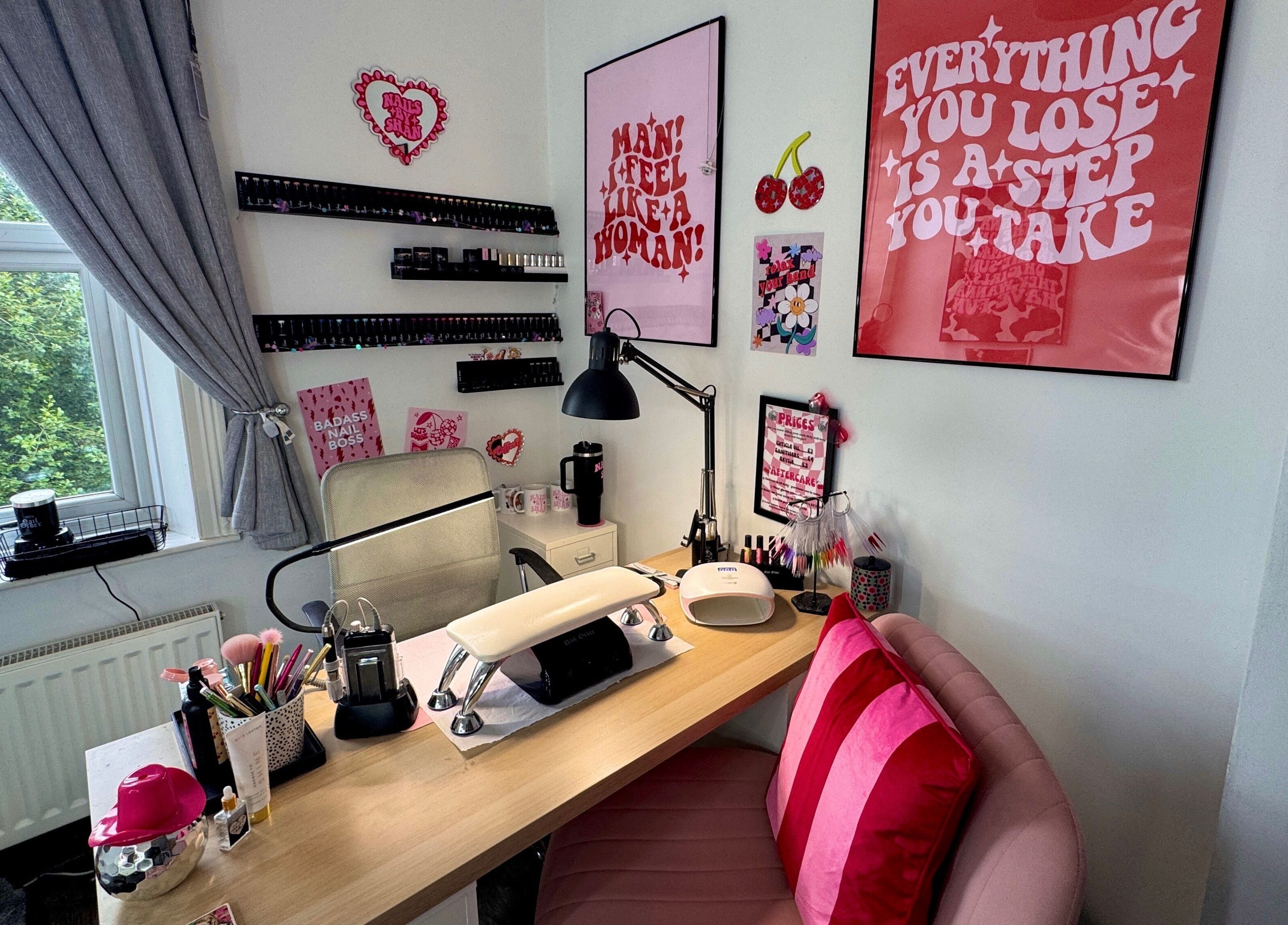 Nail station at Nails by Shan, Cleckheaton, England, GB. Stylish decor with pink accents and nail equipment.