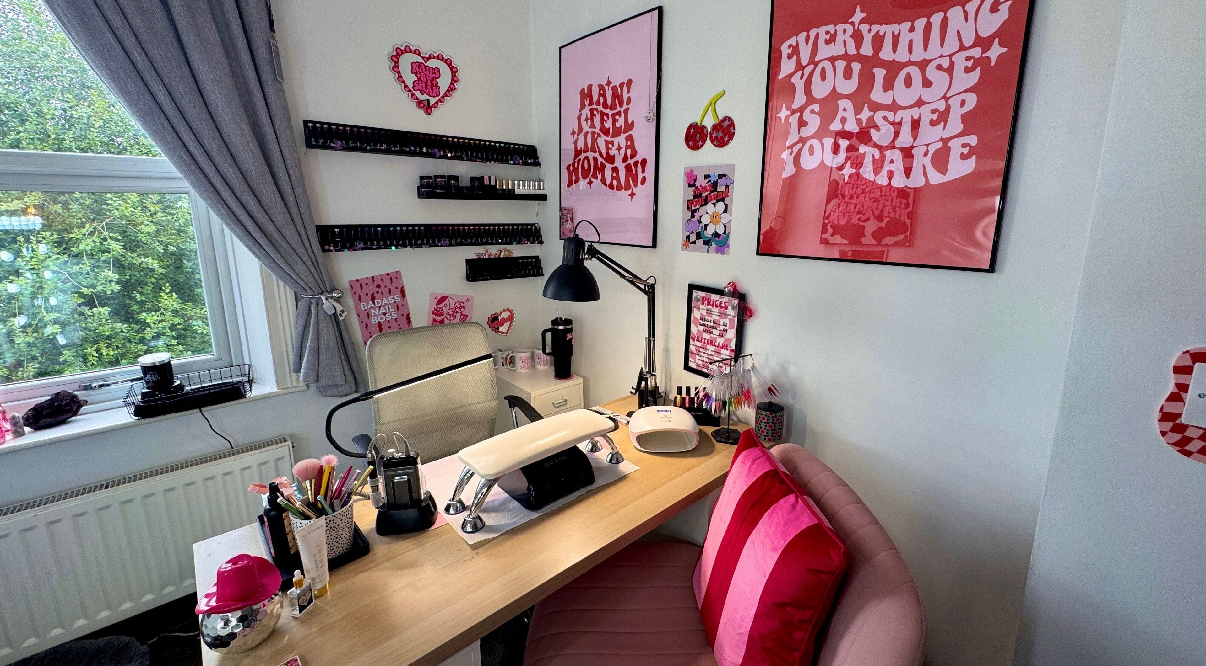 Nail station at Nails by Shan, Cleckheaton, England, GB. Stylish decor with pink accents and nail equipment.