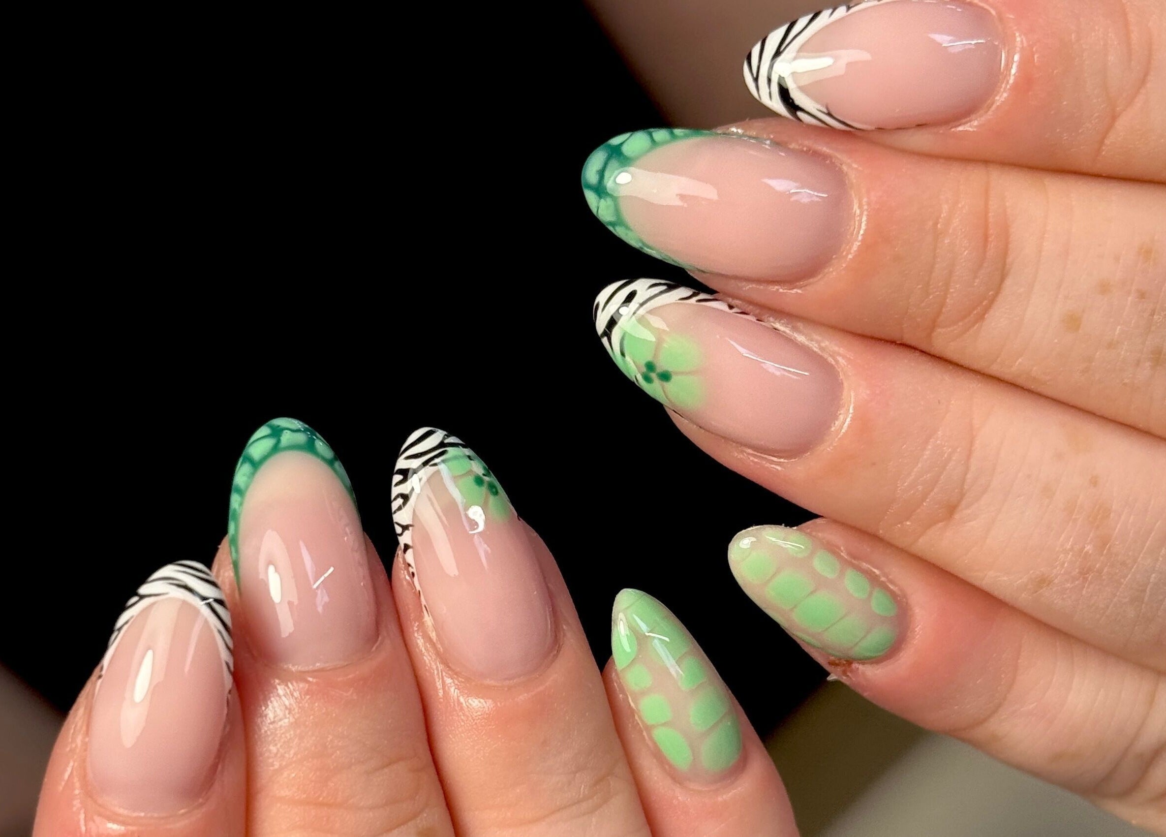 Stylish green and zebra nail art at Nails by Shan, Cleckheaton, England, GB.