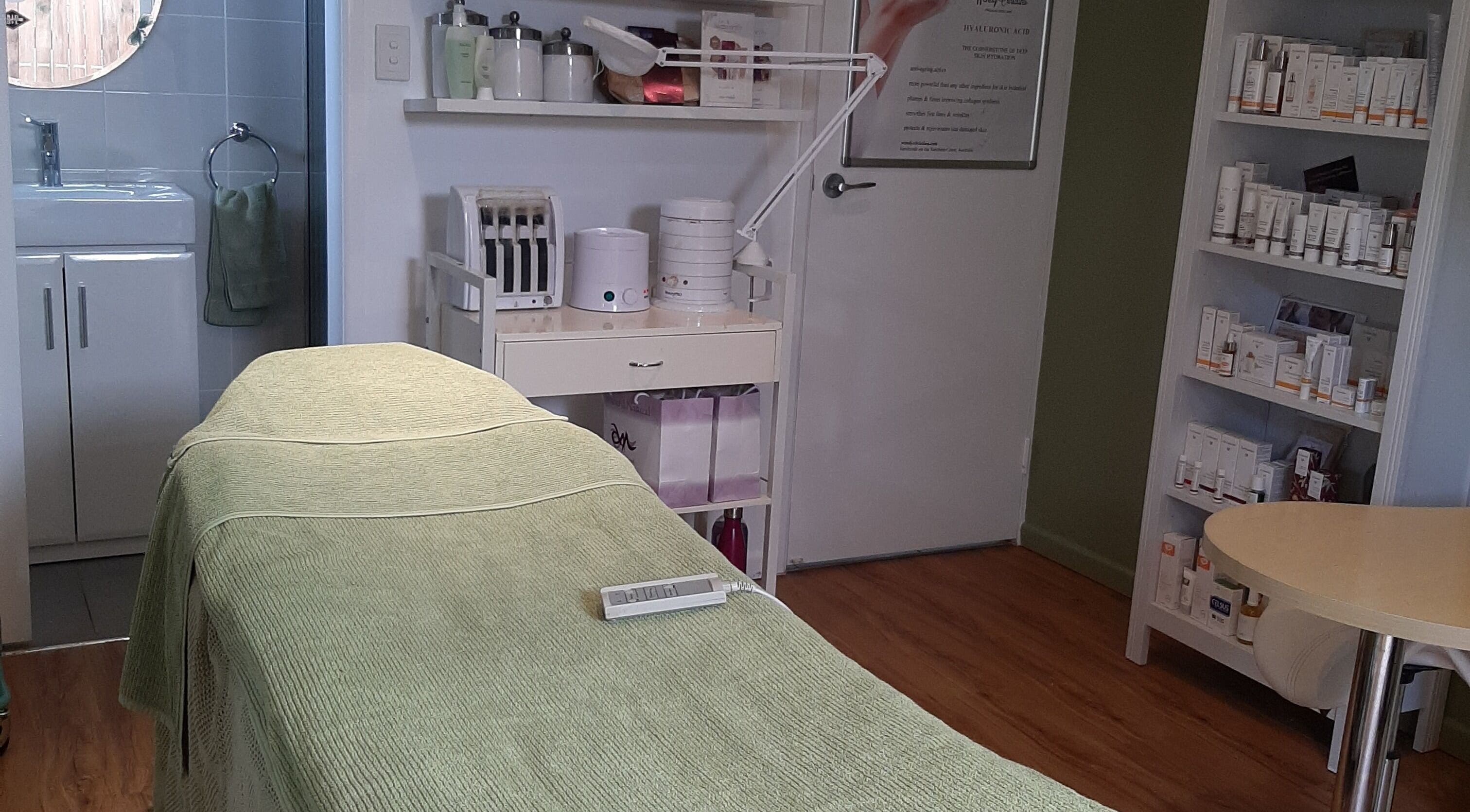Serene treatment room at Bec's Beauty In Harmony in Dicky Beach, Queensland, AU with a massage table.