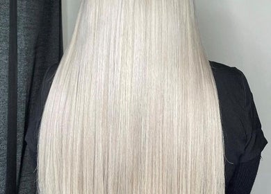Sleek blonde hair extensions at Extensions by Beth, Harrogate, England, GB.