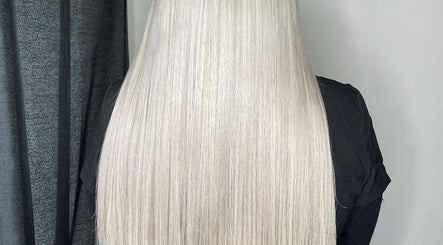 Sleek blonde hair extensions at Extensions by Beth, Harrogate, England, GB.