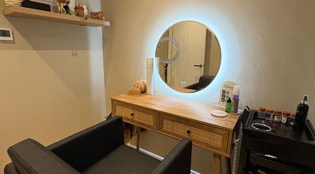 Chic beauty station at Extensions by Beth, Harrogate, England, GB, featuring a lighted mirror and sleek decor.