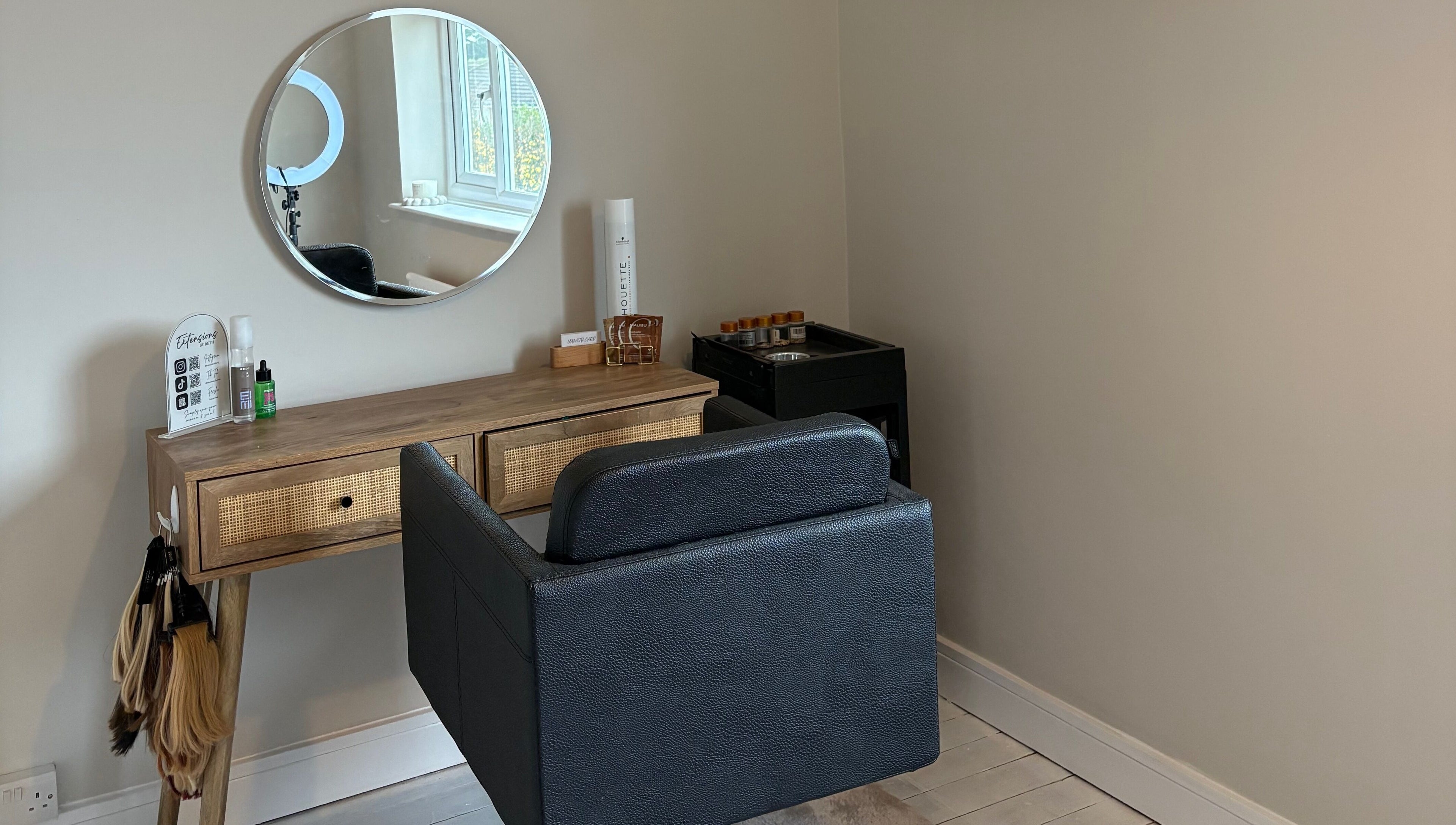 Elegant beauty station at Extensions by Beth, Knaresborough, England, GB featuring a mirror and chair.
