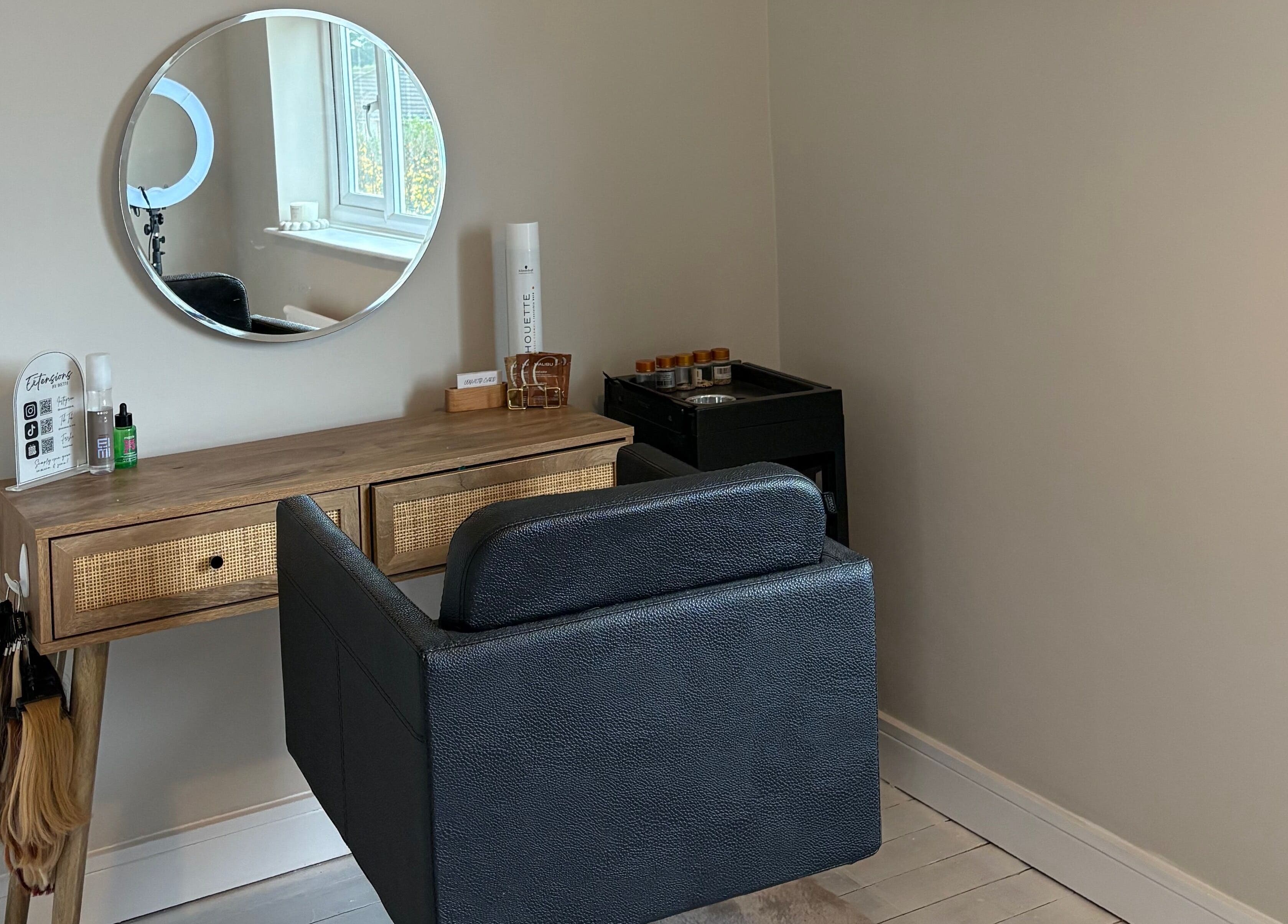 Elegant beauty station at Extensions by Beth, Knaresborough, England, GB featuring a mirror and chair.