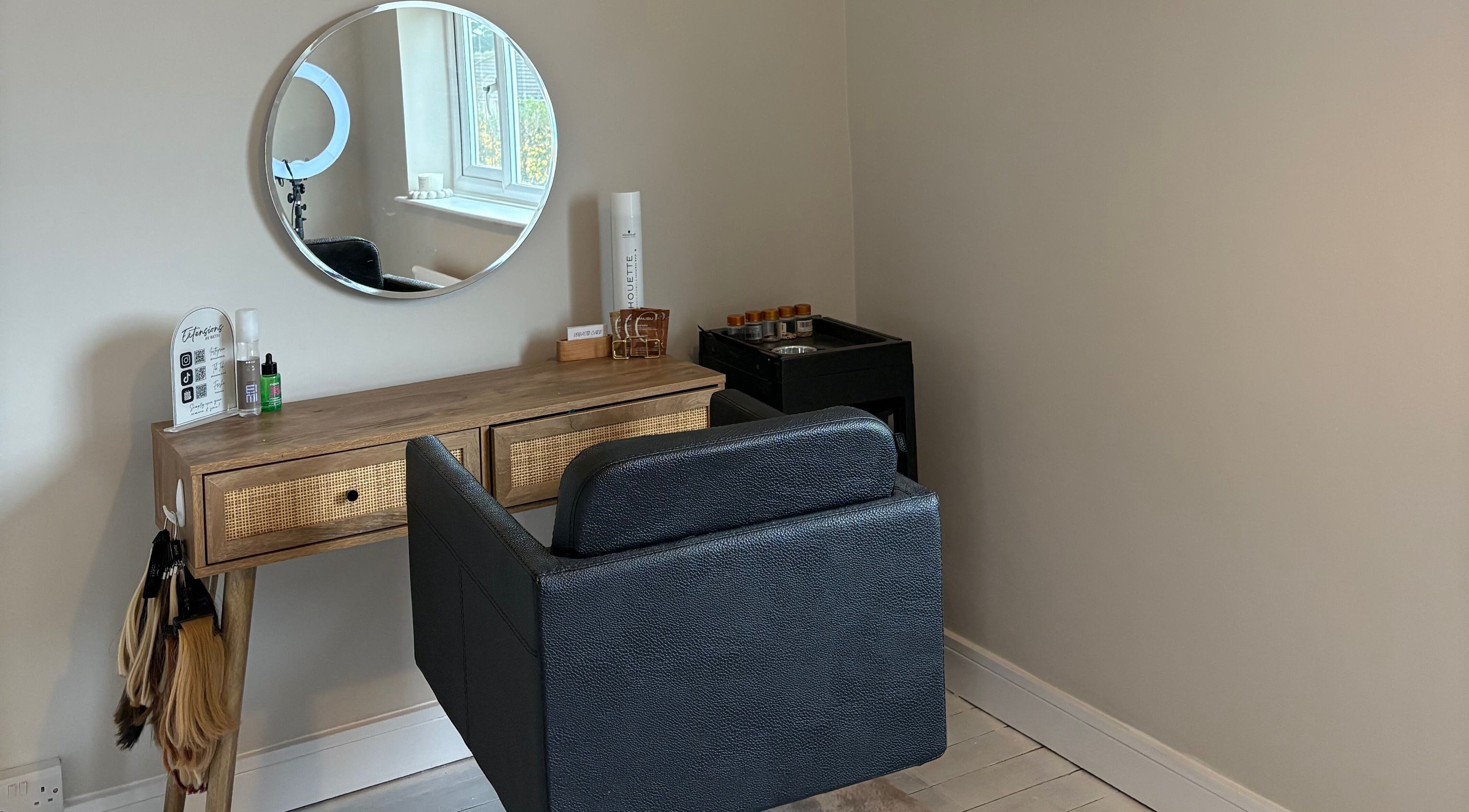 Elegant beauty station at Extensions by Beth, Knaresborough, England, GB featuring a mirror and chair.