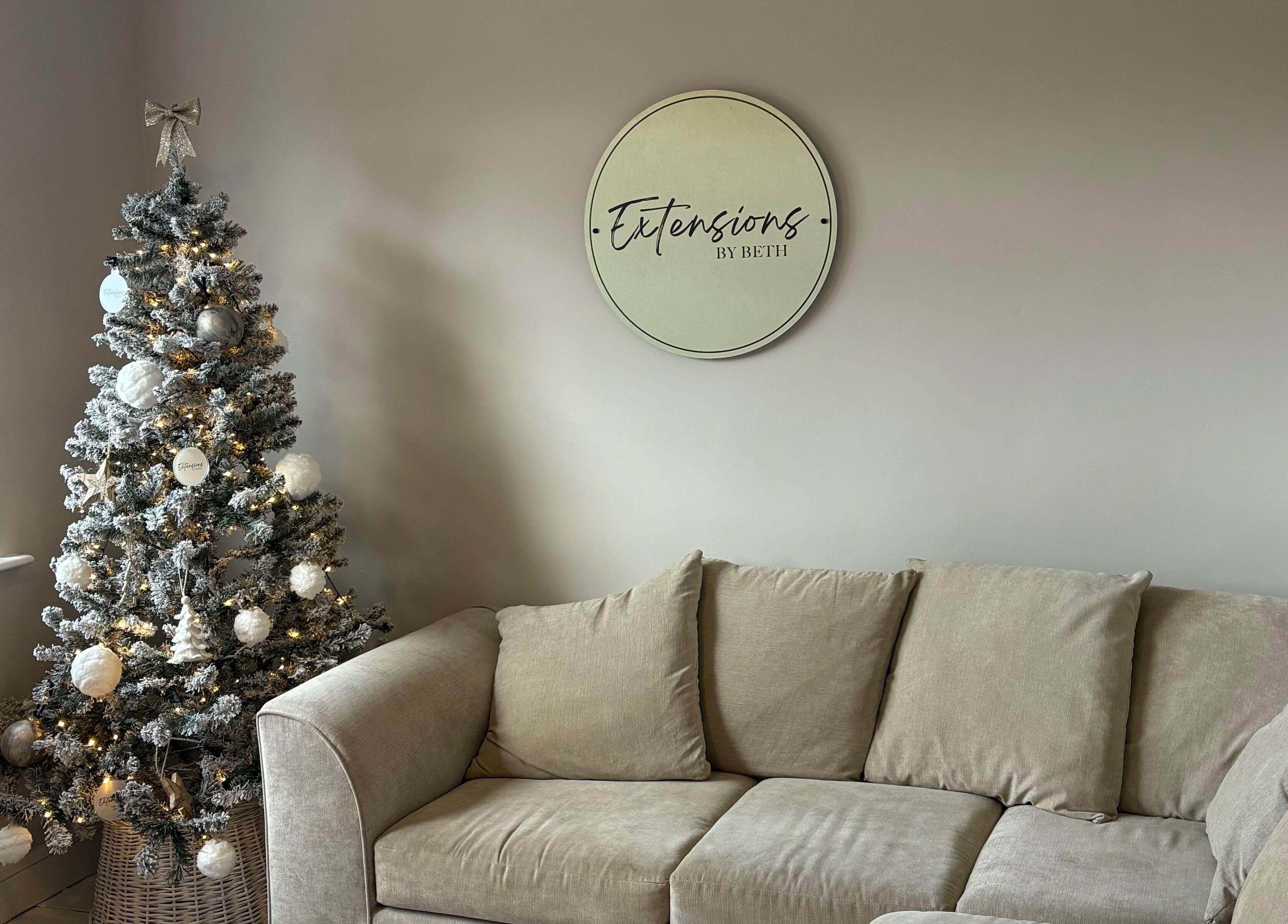 Elegant Christmas tree and cozy seating at Extensions by Beth, Knaresborough, England, GB.