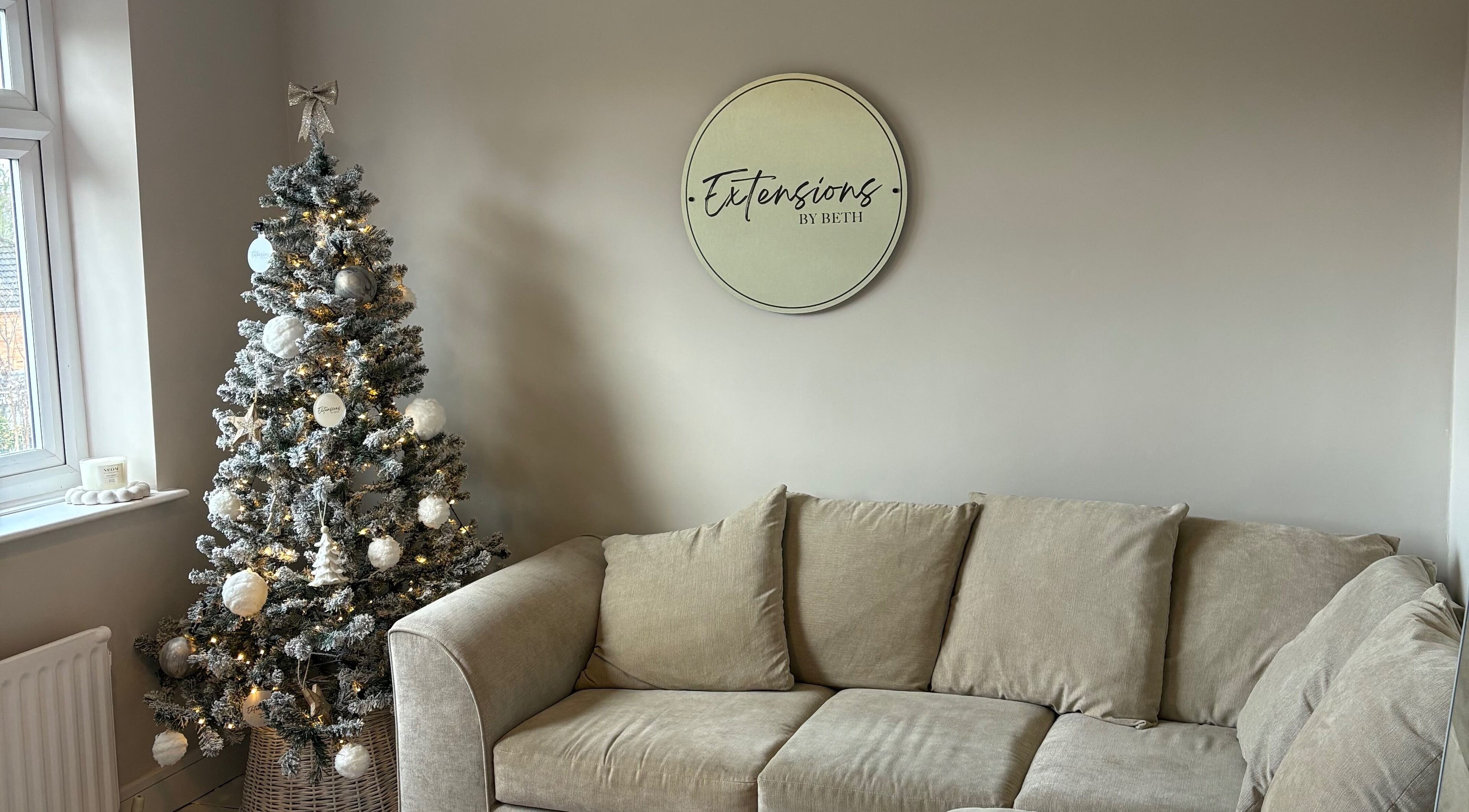 Elegant Christmas tree and cozy seating at Extensions by Beth, Knaresborough, England, GB.