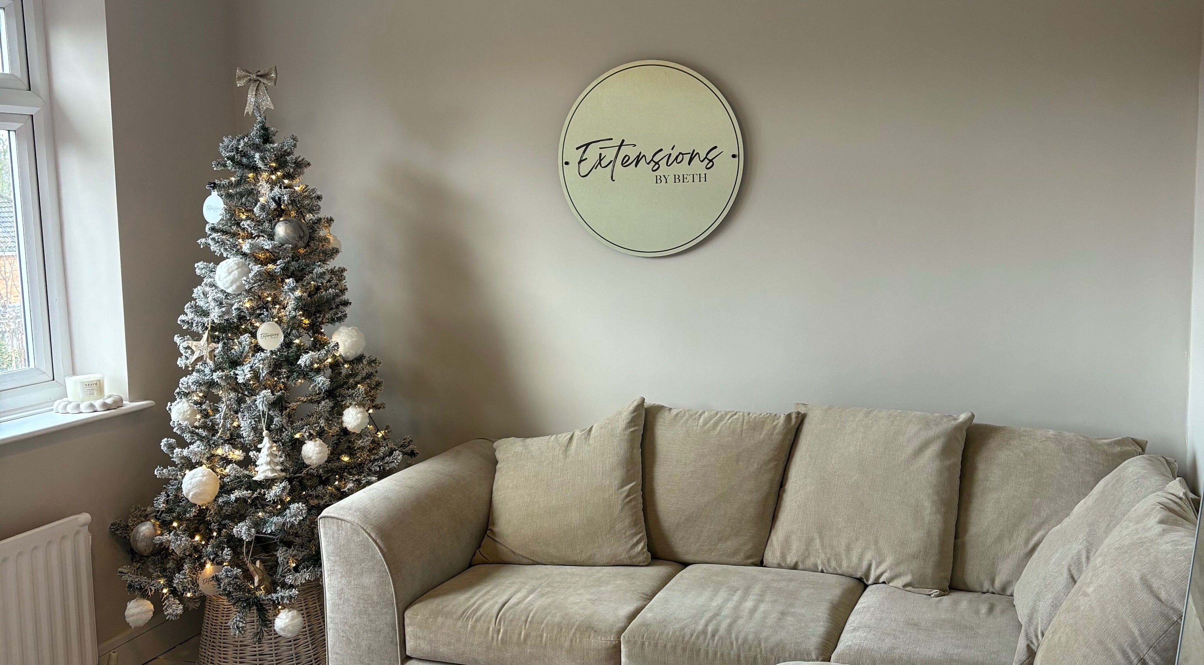 Elegant Christmas tree and cozy seating at Extensions by Beth, Knaresborough, England, GB.