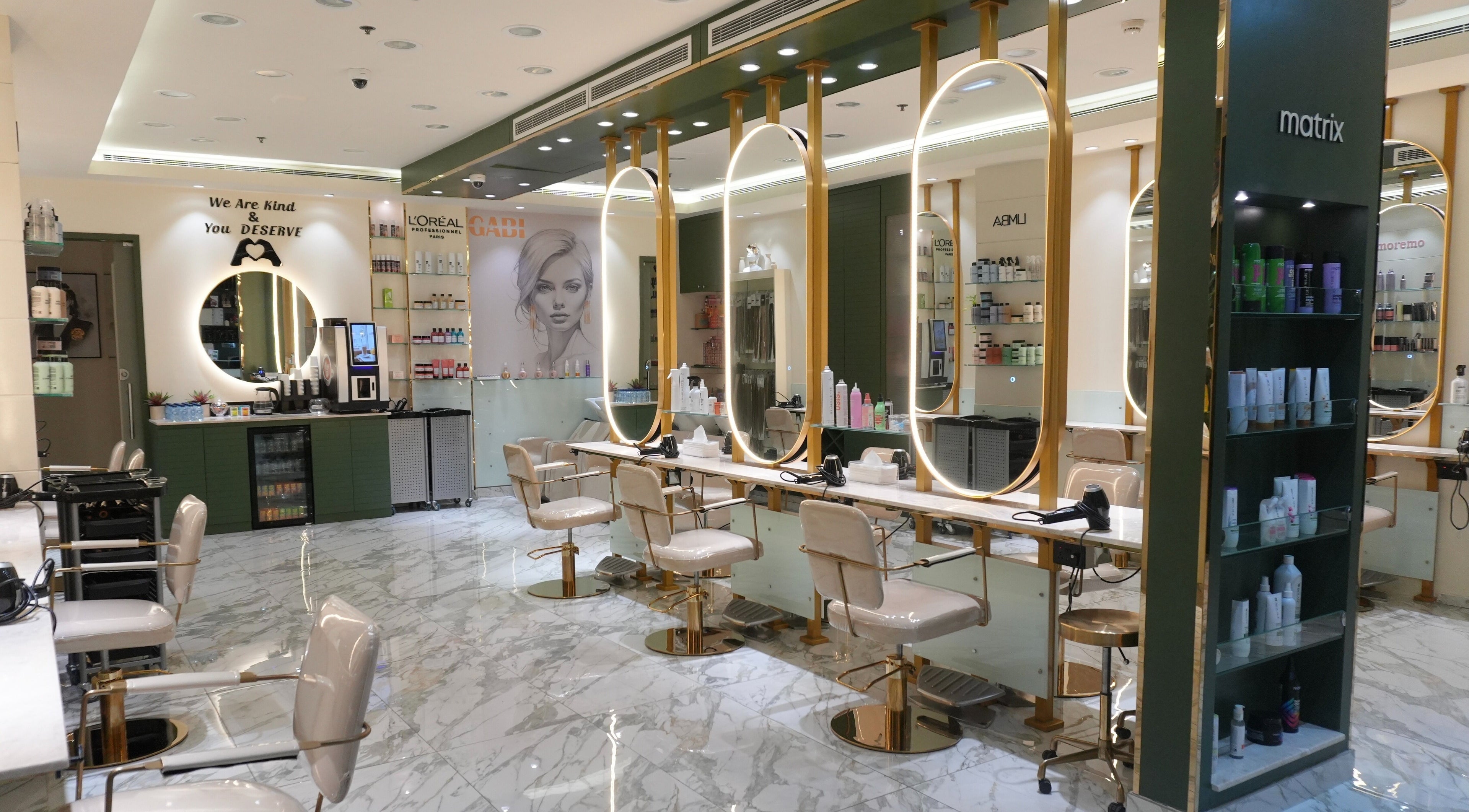 Elegant interior of Gabis Hair Coutour in Dubai, Dubai, AE, featuring modern styling chairs and mirrors.