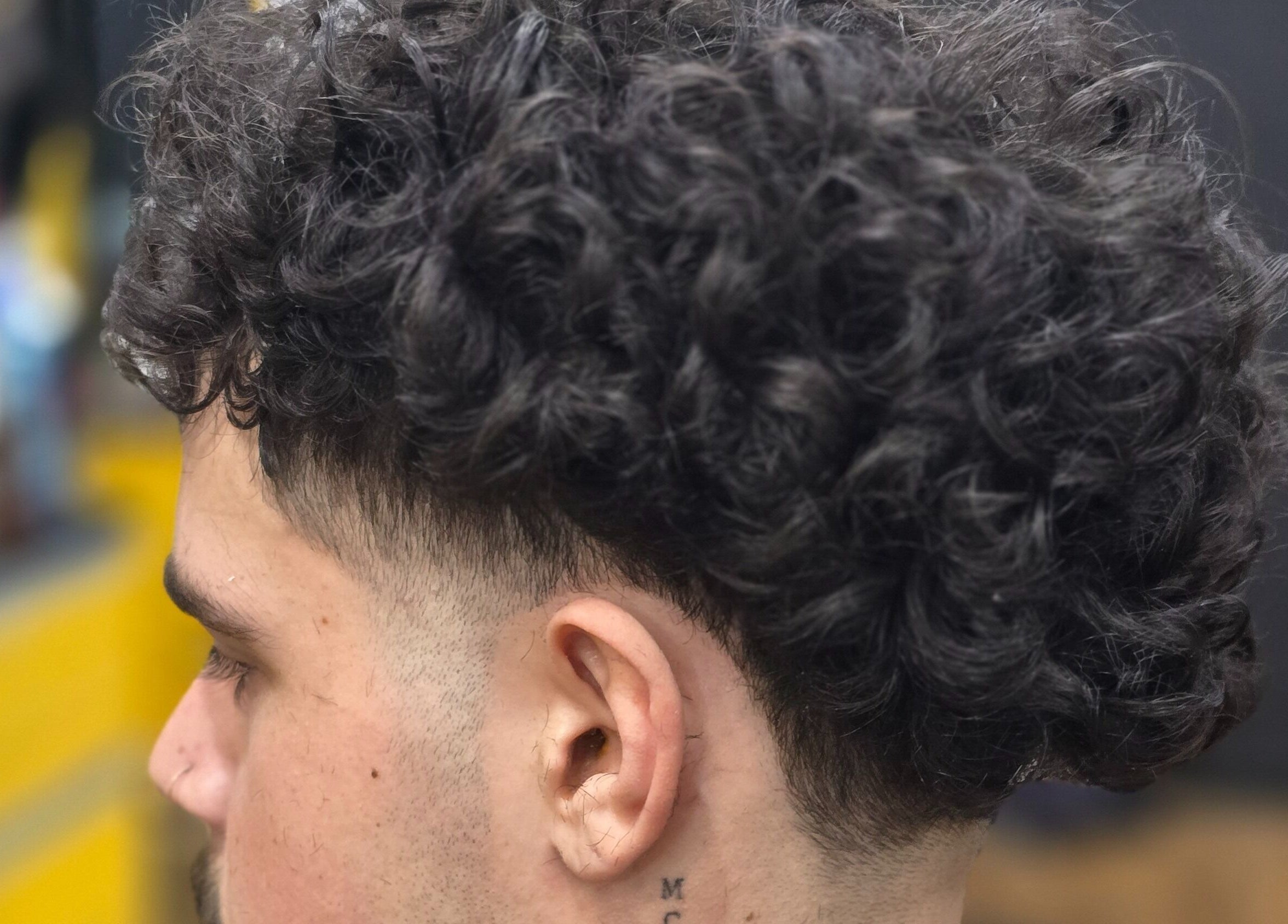 Close-up of stylish curly haircut at Kings & Queens Style Erindale, Wanniassa, Australian Capital Territory, AU.