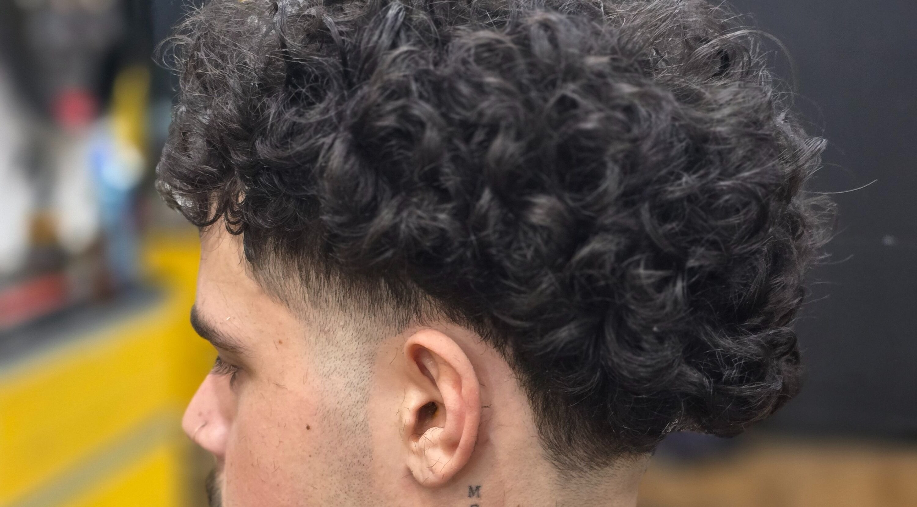 Close-up of stylish curly haircut at Kings & Queens Style Erindale, Wanniassa, Australian Capital Territory, AU.