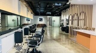 Stylish interior at Kristy Campbell at Style Bar, Werribee, Victoria, AU with modern salon chairs.