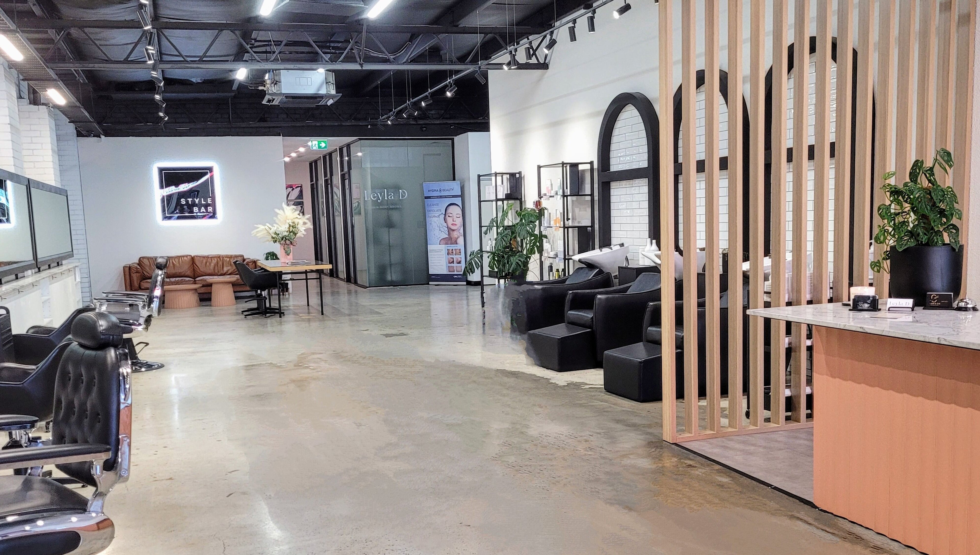 Kristy Campbell at Style Bar in Werribee, Victoria, AU. Modern salon interior with seating area and stylish decor.