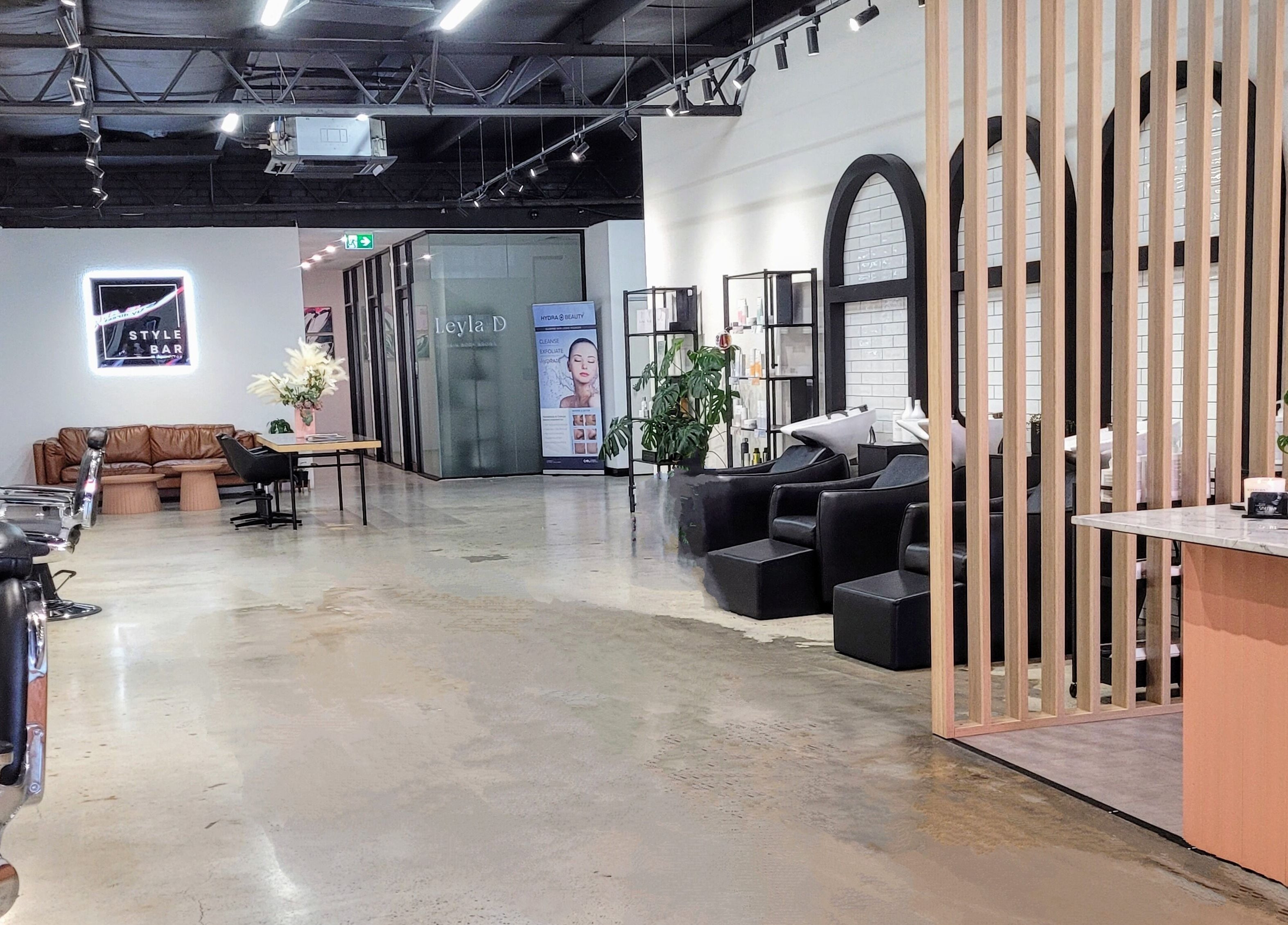 Kristy Campbell at Style Bar in Werribee, Victoria, AU. Modern salon interior with seating area and stylish decor.