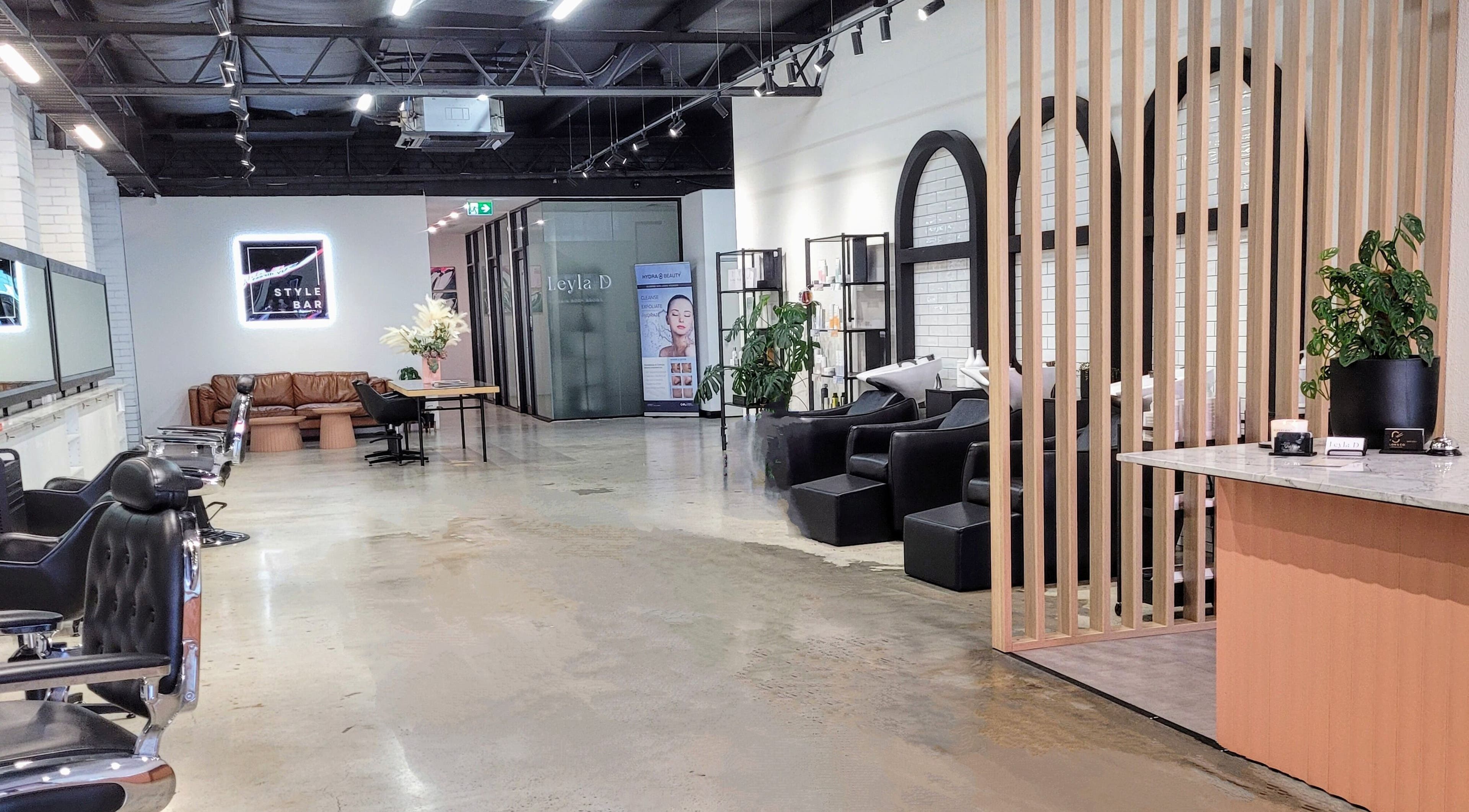 Kristy Campbell at Style Bar in Werribee, Victoria, AU. Modern salon interior with seating area and stylish decor.