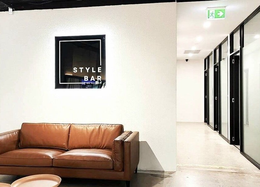 Modern lounge with leather sofa at Kristy Campbell at Style Bar in Werribee, Victoria, AU. Chic and inviting space.