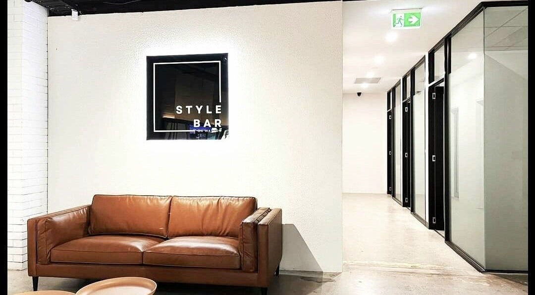 Modern lounge with leather sofa at Kristy Campbell at Style Bar in Werribee, Victoria, AU. Chic and inviting space.