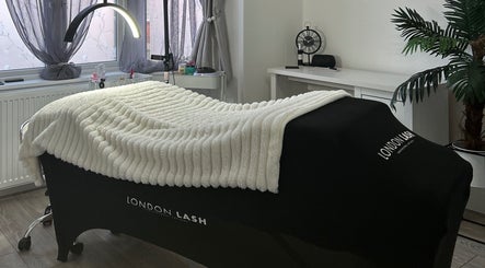 Luxurious treatment room at Libby.J.Beauty, Exmouth, England, GB, featuring a plush massage bed and serene decor.