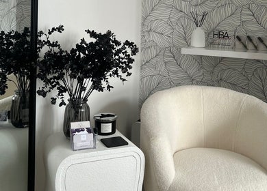 Cozy corner with chair and decor at Libby.J.Beauty, Exmouth, England, GB, showcasing serene ambiance.