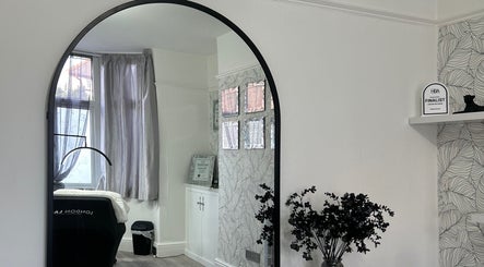 Stylish beauty room at Libby.J.Beauty, Exmouth, England, GB with a large mirror and elegant decor.
