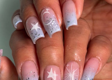 Starry nail art with moon accents at NailcraftLA, Los Angeles, California, US.