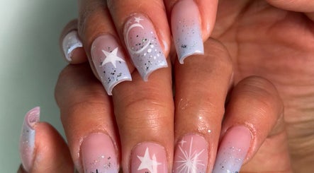 Starry nail art with moon accents at NailcraftLA, Los Angeles, California, US.